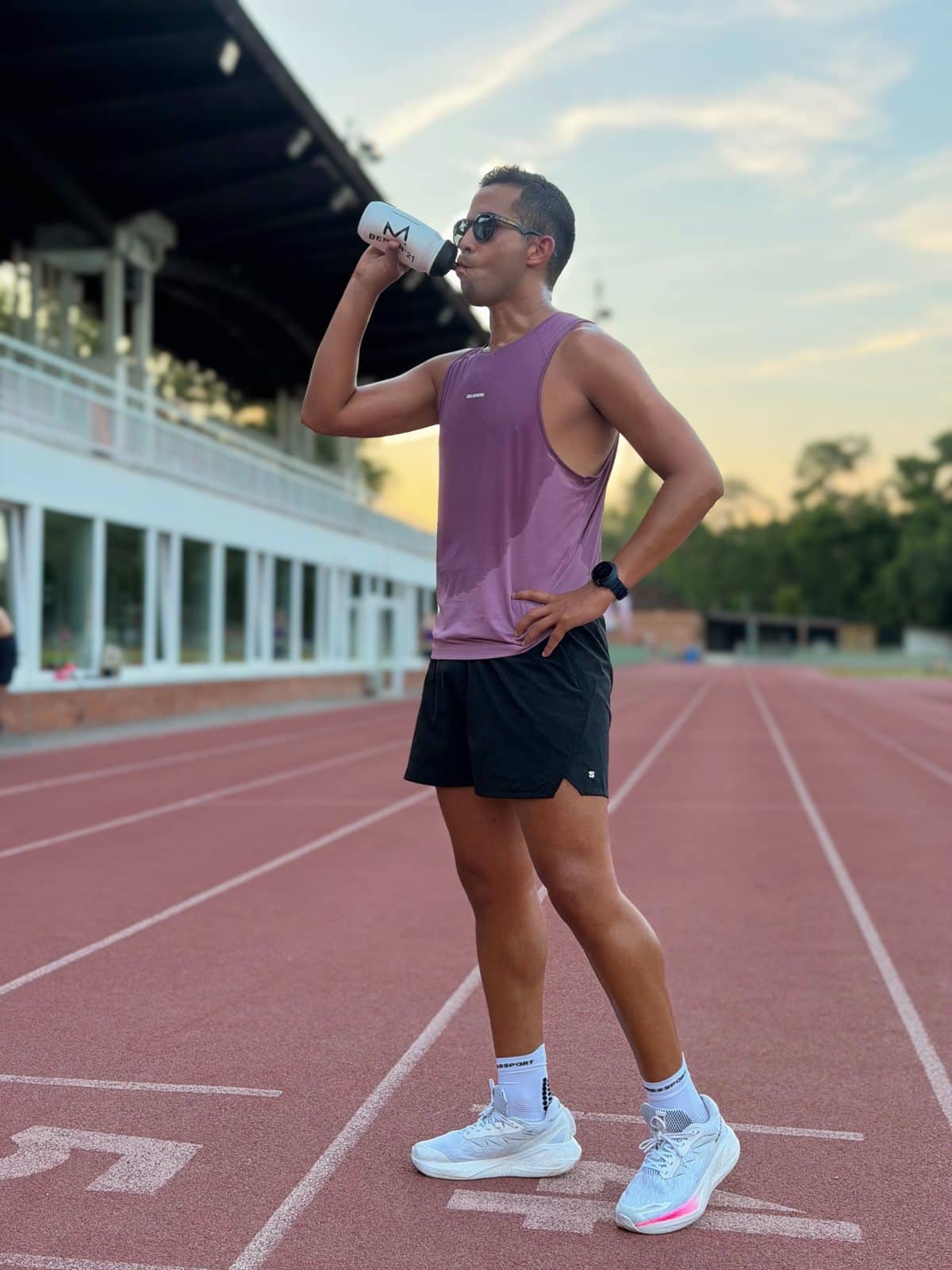 A runner catching their breath on the track after a session