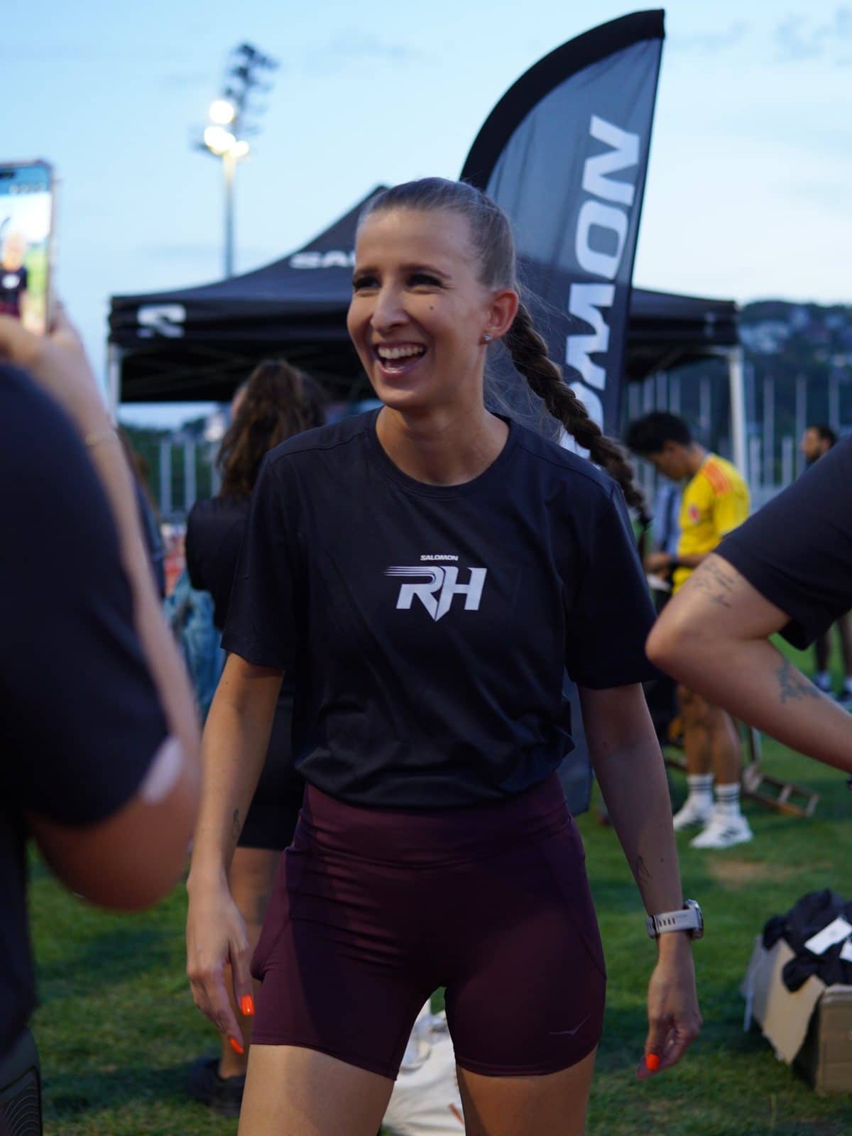 A runner laughing after a Thursday track session